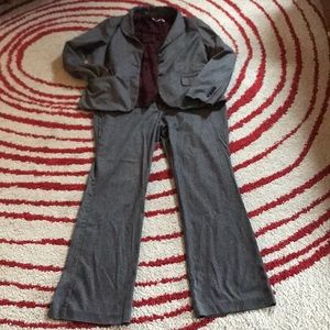 Herringbone suit with maroon sleeveless blouse